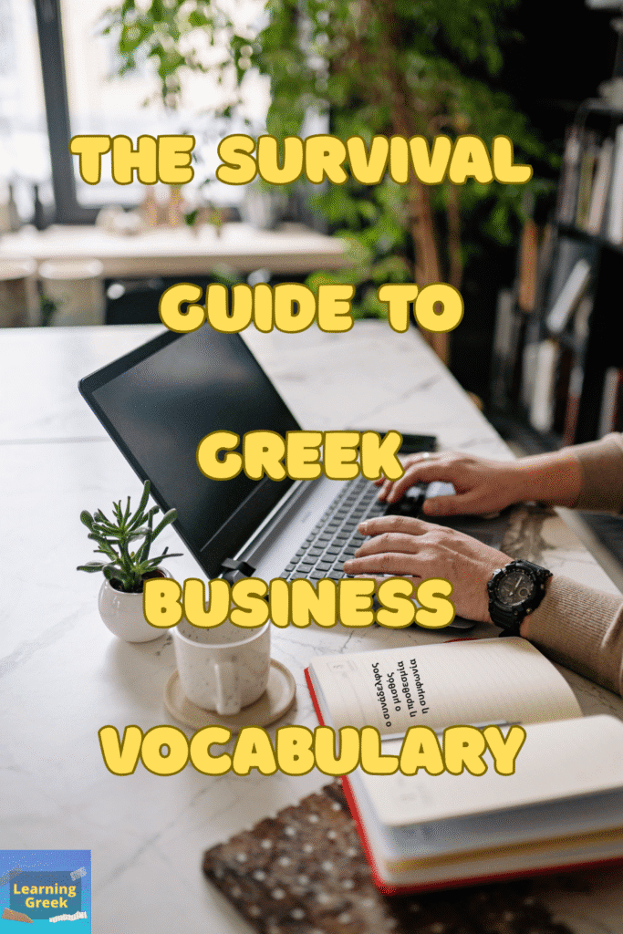 A person typing in a laptop in a work enviroment