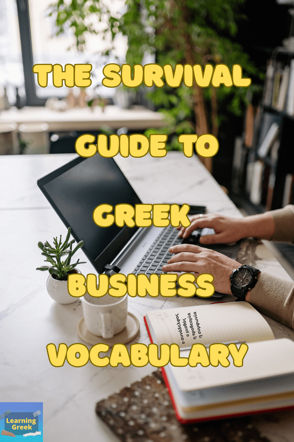 A person typing in a laptop in a work enviroment