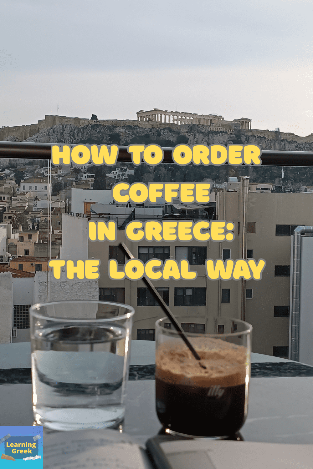 A photo I have taken with a coffee on a table and Acropolis as background