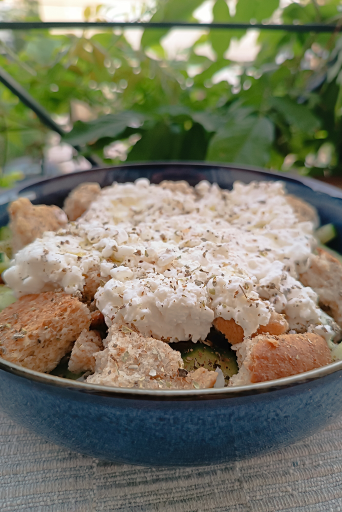 All ingredients in a bowl for my choriatiki and dakos style salad